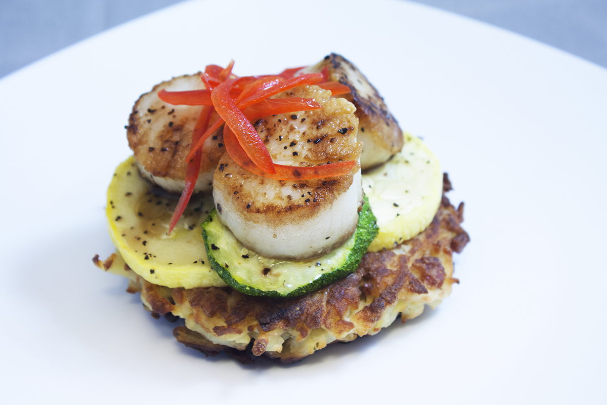 Scallops on vegetables and potato latke Scallops on vegetables and potato latke