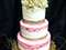 Three large tiered cake with rustic decorations